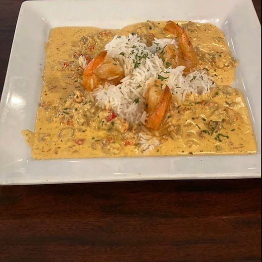 Here’s our dinner feature: Shrimp with Crawfish Sauce over Basmati rice..